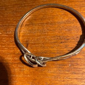 Gently used, sterling silver bangle with diamond chips